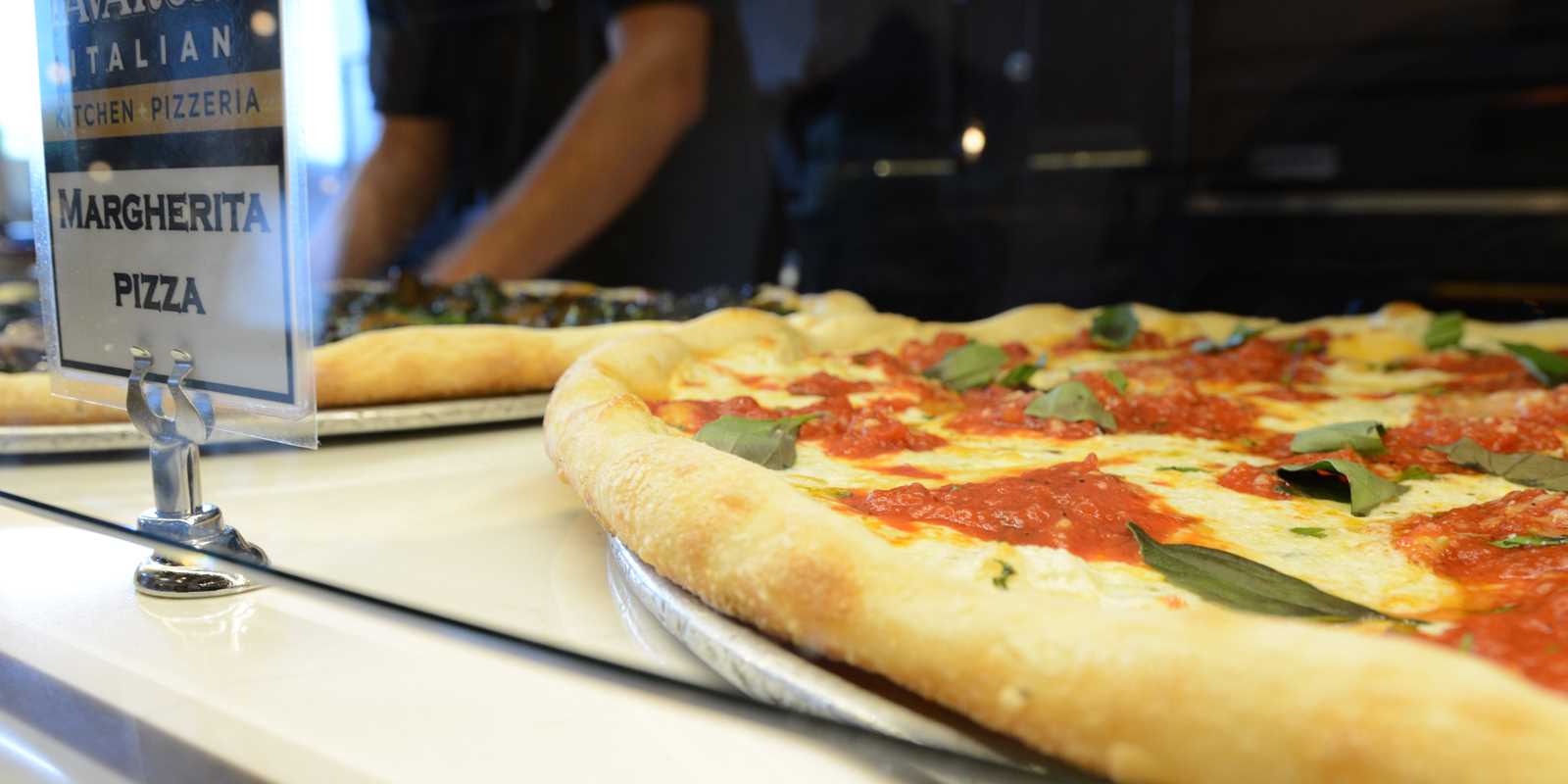 Pizza chef in the kitchen making pizza